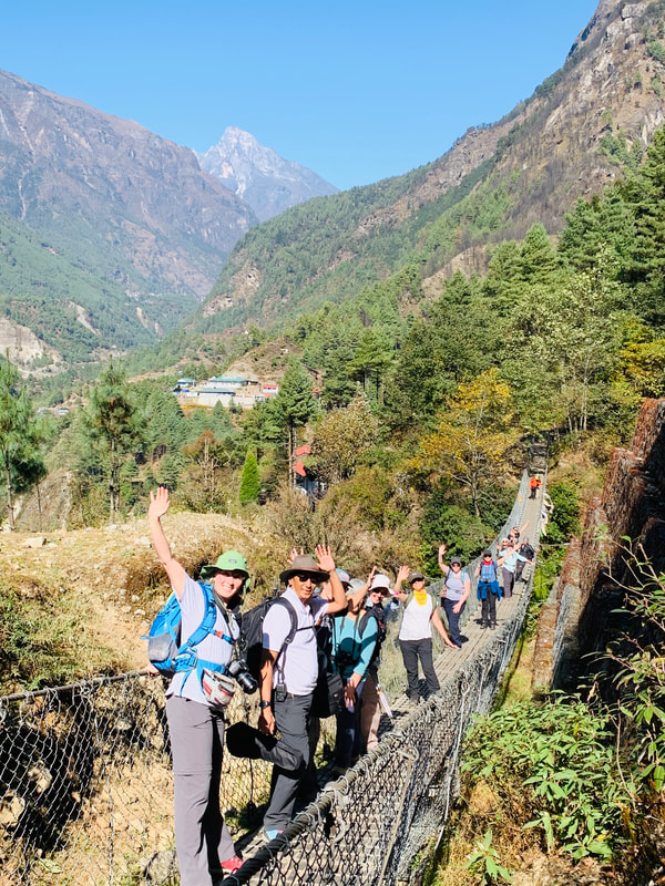 Visitors are hiking through a beautiful suspension bridge